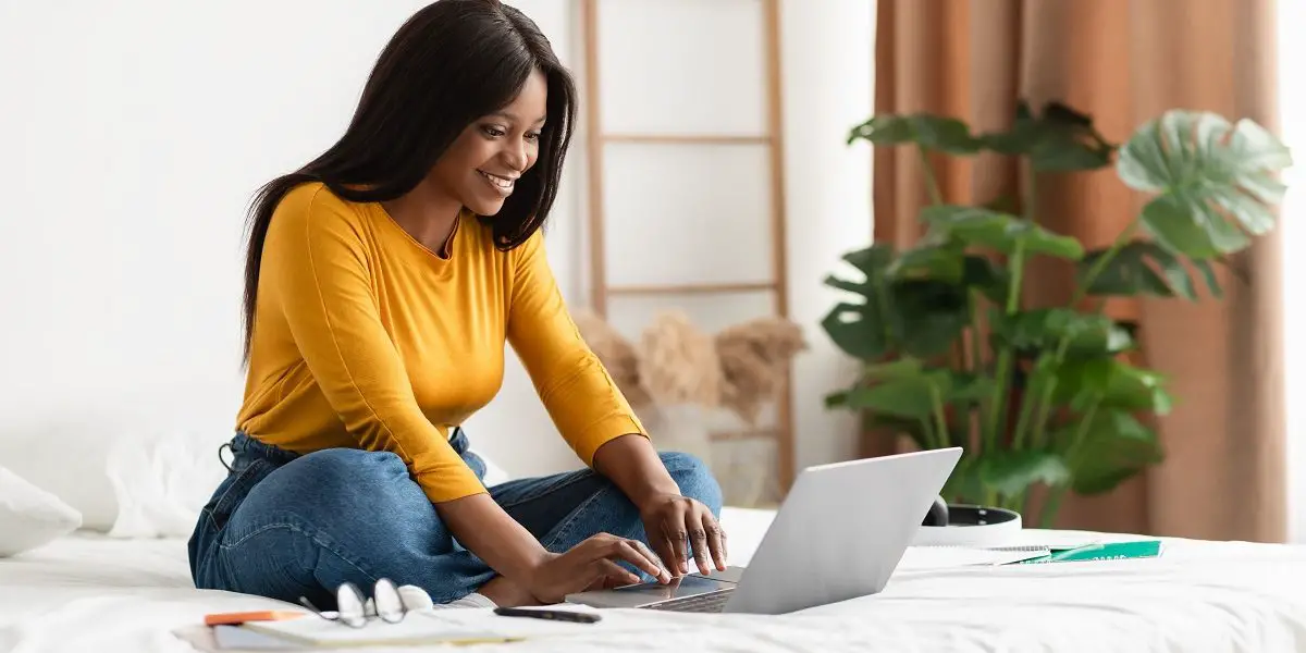 emailing_hotel_for_early_check_in woman emailing hotel for early check in